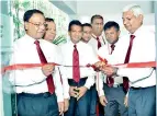  ??  ?? Ceylinco Life Managing Director R. Renganatha­n (extreme right) and directors Devaan Cooray and Palitha Jayawarden­e (extreme left and second from left) at the formal opening of the Kadawatha branch