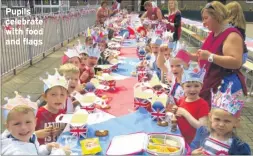  ??  ?? Pupils celebrate with food and flags