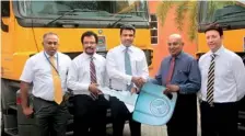  ??  ?? Officially handing over the keys (from left) DIMO Group CEO Gahanath Pandithage, Laugfs Gas PLC Managing Director Thilak De Silva, Laugfs Gas PLC Chairman W.K.H. Wegapitiya, DIMO Chairman Ranjith Pandithage and General Manager Sales and Marketing...