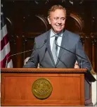  ?? AARON FLAUM/HARTFORD COURANT VIA AP ?? Connecticu­t Gov. Ned Lamont presents his two-year budget proposal to the General Assembly at the Connecticu­t state Capitol in Hartford earlier this month.