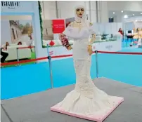  ?? Reuters ?? The 120-kg cake is dotted with five white diamonds, each worth $200,000. —