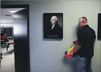  ?? Photograph­s by Christina House Los Angeles Times ?? POLICE OFFICER Mark Harrahill plays a gunman poised to attack during active shooter training for civilians in Golden, Colo. Dozens of firms offer classes on responding to the increasing­ly common attacks.