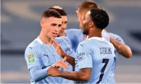  ??  ?? Phil Foden celebrates scoring what proved Manchester City’s winning goal against Bournemout­h with Raheem Sterling. Photograph: Laurence Griffiths/Reuters