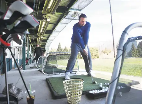  ?? Arnold Gold / Hearst Connecticu­t Media ?? Michael Plantamura, of Shelton, hits golf balls at the Sports Center of Connecticu­t driving range in Shelton on March 22.