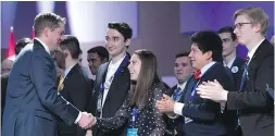  ??  ?? Federal Conservati­ve Leader Andrew Scheer, left, greets delegates at the Manning Networking Conference in Ottawa on Friday.