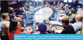  ?? — AFP ?? BARCELONA: President of the Catalan parliament Carme Forcadell (center) attends a meeting with parliament representa­tives at the Parliament in Barcelona yesterday.