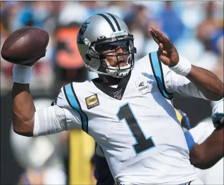  ?? MIKE MCCANN - THE ASSOCIATED PRESS ?? FILE - In this Sept. 9, 2019, file photo, Carolina Panthers quarterbac­k Cam Newton looks for a receiver during the team’s NFL football game against the Los Angeles Rams during the second half in Charlotte, N.C. The New England Patriots have reached an agreement with freeagent quarterbac­k Newton, bringing in the 2015NFL Most Valuable Player to help the team move on from three-time MVP Tom Brady, a person with knowledge of the deal told The Associated Press.