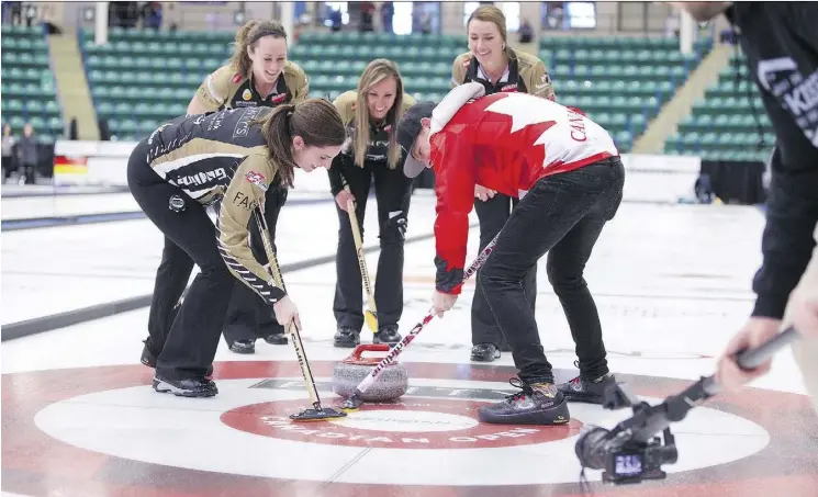  ??  ?? Canadian country singer Brett Kissel learns to curl with Canadian Olympians Lisa Weagle, Joanne Courtney, Rachel Homan and Emma Miskew in Camrose earlier this week.