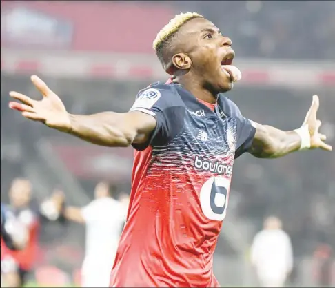  ??  ?? Osimhen wheeling away in ecstasy after scoring a goal for Lille