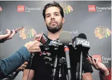  ?? ASSOCIATED PRESS FILE PHOTO ?? Blackhawks goalie Corey Crawford listens to some questions after a training camp practice at the MB Ice Arena last Friday in Chicago.