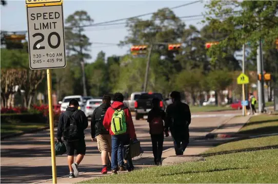  ??  ?? Karen Warren / Houston Chronicle Students walk home from school in the East Beltway 8 areaon Tuesday, near where Carlos Jose Ayala, 35, was believed responsibl­e for at least 10 sexual assaults in northeast Houston and Harris County, since 2014. Ayala...