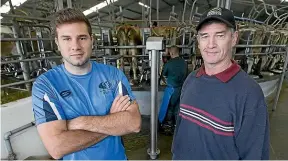  ?? MURRAY WILSON/STUFF ?? Reporter Sam Kilmister, left, goes undercover on Murray Holdaway’s Tararua dairy farm to see why the industry struggles to recruit young Kiwis.