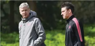  ?? AFP ?? Arsene Wenger (left) and defender Laurent Koscielny attends a training session. —