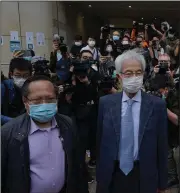  ??  ?? Pro-democracy activists Martin Lee (right) and Albert Ho (left) arrive for court Friday in Hong Kong to be sentenced for their role in organizing a 2019 anti-government march.
(AP/Kin Cheung)