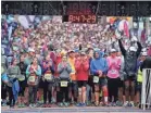  ?? THE COMMERCIAL APPEAL JIM WEBER, ?? Runners line up downtown for the 15th annual St. Jude Memphis Marathon Saturday morning. As the largest single fundraisng event for St. Jude Children's Research Hospital, organizers were expecting over 22,000 runners at this years event.