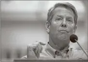  ?? Ap-alyssa Pointer ?? Georgia Gov. Brian Kemp speaks during a news conference at the Capitol building in Atlanta on Monday during the coronaviru­s outbreak. Kemp did not say whether he would extend the shelter-in-place order that is set to expire at midnight Thursday.