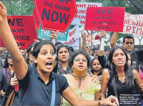  ??  ?? Participan­ts at a protest in Bangalore demand punishment for those who sexually assaulted a sixyear-old child at school KPN