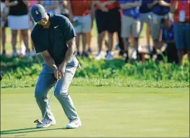  ?? ANDY LYONS / GETTY IMAGES ?? Tiger Woods shot an even-par 70 in the first round Thursday of the PGA Championsh­ip at Bellerive Country Club in St. Louis.