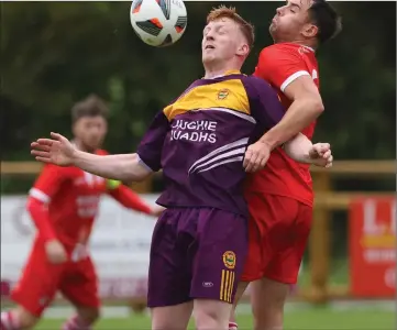  ?? ?? Marc Flanagan of Mountfield and Nathan Khan of Enniskille­n Rangers in an aerial tussle.