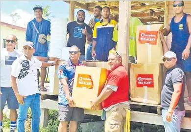  ?? Picture: SUPPLIED ?? Vodafone Fiji CEO Pradeep Lal, second from left and Ronald Prasad, right, with the relief supplies.