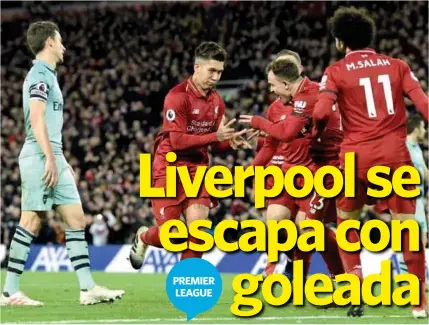  ??  ?? FIGURA. Roberto Firmino celebra con sus compañeros uno de los tres goles anotados para el Liverpool. AFP