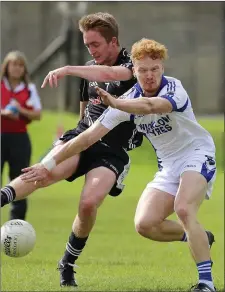  ??  ?? Newtown’s Oisin Greenan is challenged by St Pat’s John Crowe during the SFC quarter-final in Aughrim. Picture: Garry O’Neill