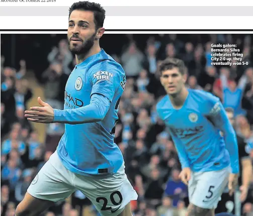  ??  ?? Goals galore: Bernardo Silva celebrates firing City 2-0 up, they eventually won 5-0