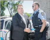  ?? — CP FILES ?? Former MP Dean Del Mastro arrives at Peterborou­gh, Ont., court for a bail hearing Friday in cuffs.