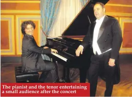  ??  ?? The pianist and the tenor entertaini­ng a small audience after the concert