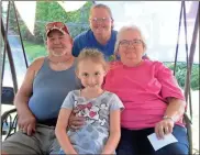  ??  ?? Larry Pinkard and Doris McNabb opened 4 Way Produce two years ago. Shown with their granddaugh­ters Heather Headrick (back) and Kindyl (front). (Catoosa News photo/Tamara Wolk)