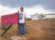  ?? Sharon Chischilly / New York Times ?? Nathaniel Garcia, a member of the Navajo Nation, stands outside his home in Window Rock, Ariz.