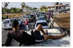  ??  ?? People waited in mile-long lines to fill up with gas at a fuel station in Cabimas, Venezuela.