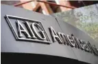  ?? — AFP ?? The logo of AIG is seen outside their office in the lower Manhattan area of New York.
