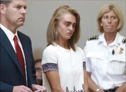  ??  ?? In this Aug. 3, 2017, file photo Michelle Carter (center) listens to her sentencing for involuntar­y manslaught­er for encouragin­g 18-year-old Conrad Roy III to kill himself in July of 2014. MATT WEST/THE BOSTON HERALD VIA AP, POOL