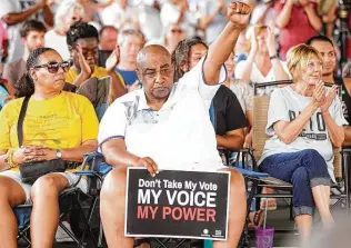  ?? Elizabeth Conley / Staff photograph­er ?? Keith Downey of Kashmere Gardens holds up a fist in solidarity during a voting rights rally in June. The new elections bill allows the Texas secretary of state to hunt the voter rolls for noncitizen­s.