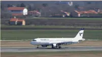  ?? (Marko Djurica/Reuters) ?? AN IRANAIR plane taxis after landing at Belgrade’s Nikola Tesla Airport.