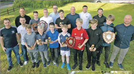  ??  ?? Junior team prizewinne­rs and coaches after the awards ceremony.