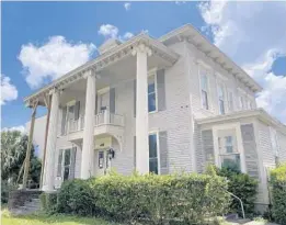  ?? JOY WALLACE DICKINSON PHOTOS ?? Orlando pioneer Samuel Robinson’s elegant home, today at 419 N. Magnolia Ave., faced a vast orange grove when it was built in 1885. Today it houses offices and faces the Orange County Courthouse. It’s a great example of the kind of historic structure highlighte­d across the country during National Preservati­on Month in May.