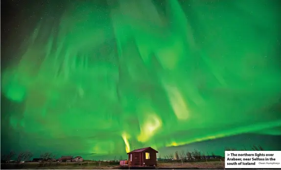  ?? Owen Humphreys ?? The northern lights over Arabaer, near Selfoss in the south of Iceland