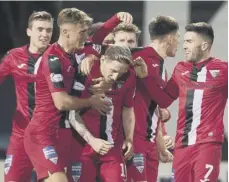  ??  ?? 0 Declan Mcmanus celebrates his last-minute equaliser for Dunfermlin­e at Dundee on Saturday