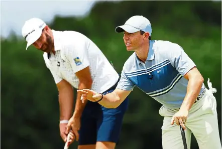  ??  ?? Competitio­n mode: Dustin Johnson (left) and Rory McIlroy in action during the two-on-two charity match on Sunday. The pair defeated Rickie Fowler and Matthew Wolff on tie-break. — AFP