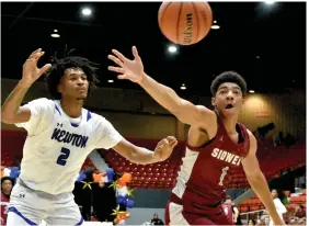  ?? (Pine Bluff Commercial/I.C. Murrell) ?? Stephon Castle (left) of Newton (Ga.) and Jalen Rougier-Roane of Sidwell Friends School (D.C.) chase a loose ball in the second quarter at King Cotton on Thursday.