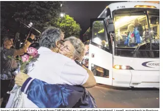  ?? TOM MCCARTHY JR. / FOR AMERICAN-STATESMAN ?? Joyce Lutrell (right) gets a hug from Cliff Wright as Lutrell and her husband, Lowell, arrive back in Bastrop on Wednesday night after being part of a Mississipp­i casino trip that ended in tragedy Tuesday when one of the buses on the trip was hit by a...