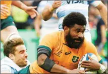  ?? ?? Australia’s Marika Koroibete is tackled by Argentina’s Los Pumas Juan Cruz Mallia, during their rugby championsh­ip match in Mendoza, Argentina. (AP)