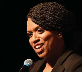  ?? CHRIS CHRISTO / HERALD STAFF ?? RALLYING THE FAITHFUL: U.S. Rep. Ayanna Pressley speaks at a ‘community swearing-in’ ceremony at Roxbury Community College in Boston on Saturday.