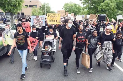  ?? Arnold Gold / Hearst Connecticu­t Media ?? Members of the Citywide Youth Coalition lead a march protesting police brutality and the killing of George Floyd organized with Black Lives Matter New Haven down State Street in New Haven to the New Haven Police Department on June 5.