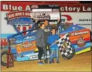  ?? RICK KEPNER - FOR DFM ?? Ryan Watt, center, is joined in victory lane by his wife Leslie and son Logan after winning the Money in the Mountains race at Big Diamond on June 2.