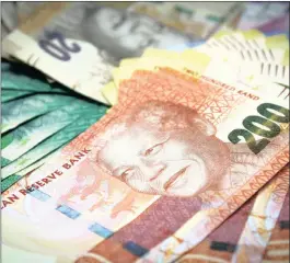  ?? PHOTO: BLOOMBERG ?? Rand banknotes arranged for display in this file photo. The Competitio­n Commission alleges that 14 banking entities have colluded to manipulate the value of the rand.