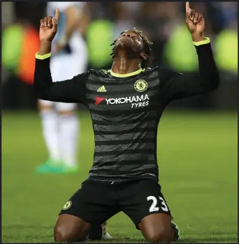  ??  ?? Chelsea’s goal hero Michy Batshuayi drops to his knees after the final whistle as the league flag is won