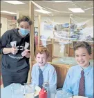  ?? COURTESY FITCHBURG DINER ?? Fitchburg Diner server Ali Ravellette with owner Ted Turner's grandsons Christophe­r and Jack Triolo during a recent lunchtime stop.